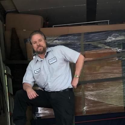 Rod Matthews of Citywide Moving Systems with carefully wrapped cargo